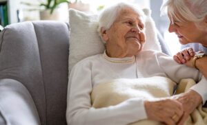 Photo of a senior woman and a caregiver at a nursing home